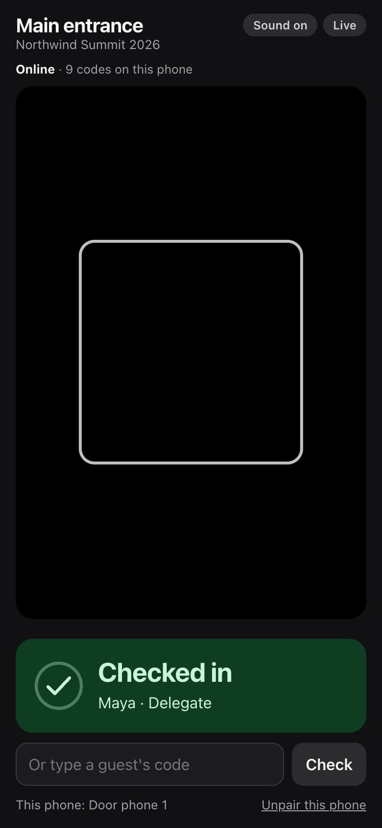 Door scanner on a phone showing a green Checked in confirmation for a delegate