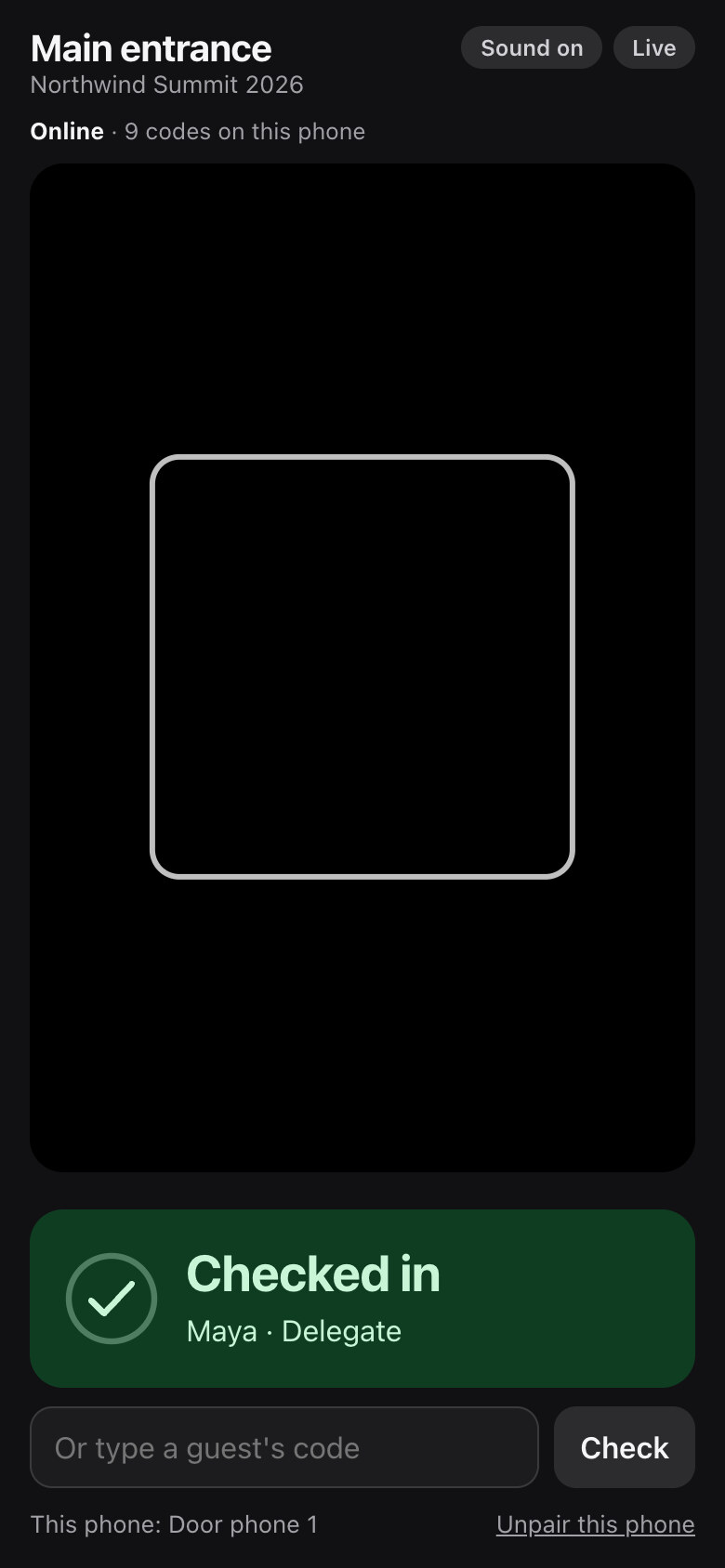 A door scanner phone confirming a checked-in guest